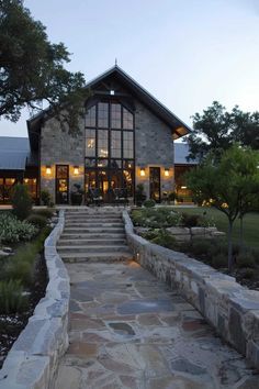 a stone house with steps leading up to it