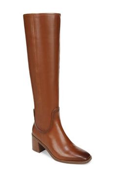 A stretchy back panel lends easy wear to an equestrian-inspired boot balanced by a squared-off toe and stacked block heel. 2 1/2" heel (size 7.5) 16" shaft; 14" calf circumference Cushioned footbed with Contour+ technology and arch support Leather upper/synthetic lining/rubber sole Imported