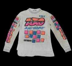 Please read all description carefully before buying. If you have any questions feel free to ask. Vintage clothing fits differently from modern day clothing. Please don't just rely on tag size, make sure to check all the measurements given below for an accurate size. PLEASE CHECK ACTUAL SIZE CAREFULLY, NO RETURNS OR COMPLAINT FOR WRONG SIZE ACTUAL. Vintage 1990 Axo Earthquake Motocross Jersey with Signature  Colour : Multicolour  Size on tag : -  Brand : Axo Condition : Good condition. Yellowish.  MEASUREMENT Armpit to armpit : 19" Length : 27" ACCEPT PAYPAL ONLY.  Shipping cost is $18 for economy or $28 DHL Express wordwide shipping. Transit time can take  2-3 weeks for economy and 3-5 business days by DHL Express to reach destination.  Please leave your phone number on the note while make 90s Style Long Sleeve Shirt For Streetwear, 90s Long Sleeve Shirt For Streetwear, 90s Style Long Sleeve Graphic Print Shirt, 90s Style Long Sleeve Shirt With Graphic Print, 90s Long Sleeve Shirt With Graphic Print, Vintage Long Sleeve Tops With Graphic Design, Vintage Long Sleeve Graphic Tops, Retro Long Sleeve Tops With Graphic Design, Motocross Shirts