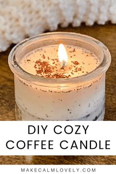 a candle that is sitting on a table with the words diy cozy coffee candle