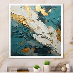 an abstract painting with gold and teal colors on a white wall above a fireplace mantel