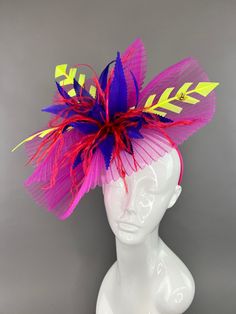 Fuchsia fascinator with accents of light purple, red and neon yellow. Attaches with interchangeable hair clip or headband. One size fits all. Please note all sales are final. don't forget to follow us on Instagram @TheHatHive Fun Party Fascinator With Headband, Fun Party Fascinator On Headband, Multicolor Hair Accessories For Carnival Party, Purple Carnival Headpiece For Party, Purple Headpiece For Party And Carnival, Purple Headpieces For Party And Carnival, Multicolor Carnival Headband Fascinator, Multicolor Headband Fascinator For Party, Multicolor Headband Fascinator For Weddings