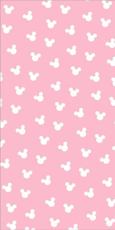 a pink background with white mickey mouse heads