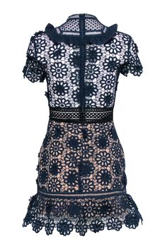 Ready to make a statement at your next cocktail party? Slip into this navy lace eyelet short sleeve dress from Self-Portrait, paired perfectly with black strappy heels. This dress is both elegant and fun, making you the center of attention at any event. Size 2 Shell 97% Polyester, 6% Polyamide Lining 97% Polyester, 3% Spandex Invisible zipper back Short sleeve Semi sheer details Black lace up tie detail Mock neck Ruffle trim Bust 34" Waist 27" Shoulder to hem 33" Sleeve length 7" Chic Short Sleeve Lace Evening Dress, Spring Short Sleeve Lace Dress For Night Out, Spring Lace Dress With Short Sleeves For Night Out, Chic Lace Dress With Short Sleeves For Date Night, Chic Short Sleeve Lace Dress For Date Night, Chic Scalloped Lace Short Sleeve Mini Dress, Summer Lace Dress With Short Sleeves For Night Out, Summer Short Sleeve Lace Dress For Night Out, Chic Short Sleeve Mini Dress With Scalloped Lace