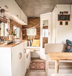 a small kitchen and dining area in a tiny home