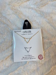 the capricorn necklace is in its package