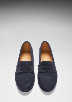 Hugs & Co. navy blue penny loafers for women. Moccasin style loafers in a soft navy blue suede outer and lined with tan leather for extra comfort. The lightweight leather sole achieves a low profile silhouette for this style. Italian Suede Upper Leather sole Natural Tan Leather Lining Traditional Hand Stitching Lightly Padded Insole Made in Portugal Penny Loafers For Women, Womens Penny Loafers, Soft Navy Blue, Style Loafers, Profile Silhouette, Moccasins Style, Penny Loafer, Natural Tan, Penny Loafers