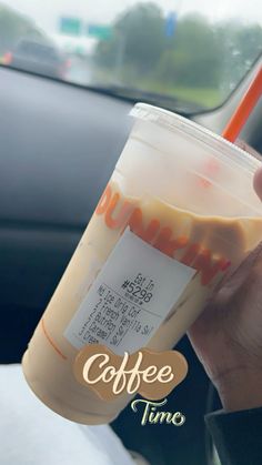 a person holding up a coffee drink in their hand with the words coffee time written on it