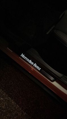 a close up of a car door with the word mercedes benz on it