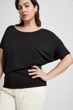 "The Elena Top is a draped dream. She features an off-center scoop neck and asymmetric sleeves with a batwing on one side while extending down effortlessly to hug your hips. Fashioned from our silky-soft, eco-friendly European jersey, Elena's ideal for all day wear and versatile enough for professional or casual. Tuck her in to create a sleek look or wear her out to show off the unique silhouette. GET THE LOOK Top: this listing Pants: Madewell | https://etsy.me/33FtwlX Shoes: https://etsy.me/3hv Batwing Shirt, Minimalist Blouse, Slate Green, Night Tops, Scoop Neck Blouses, In The Mood, Off Shoulder Tops, Ethical Fashion, The Mood