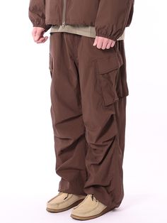 Editor's NotesTHAT`S IT's parachute pants has a trendy and casual look with diagonal cargo pocket detail, deep tuck, and string and stopper on the hem. You can style it with various items during multiple seasons. - Diagonal cargo pocket detail- Natural wrinkle on the fabric- Deep tuck for wide silhouette- String and stopper on the hemMeasurements (in.)M/L/XL- Length: 41.34 in. / 41.73 in. / 42.13 in.- Waist: 12.60 in. / 12.99 in. / 13.78 in.- Rise: 15.75 in. / 16.14 in. / 16.14 in.- Hip: 21.65 in. / 22.44 in. / 23.23 in.- Thigh: 14.17 in. / 14.57 in. / 14.96 in.- Hem: 9.84 in. / 10.24 in. / 11.02 in.* Model info: Height 6'1, Weight 143 lbs, Wearing size XLComposition & Care- Nylon 100%- Refer to care labelDesigner- by THAT`S IT Brown Baggy Cargo Pants For Fall, Brown Cargo Parachute Pants, Brown Cargo Pants With Pockets For Outdoor, Brown Parachute Pants With Multiple Pockets For Outdoor, Brown Parachute Pants With Side Pockets For Outdoor, Brown Pants With Side Pockets For Outdoor Activities, Brown Baggy Utility Pants, Brown Utility Pants For Outdoor Activities, Baggy Brown Utility Pants