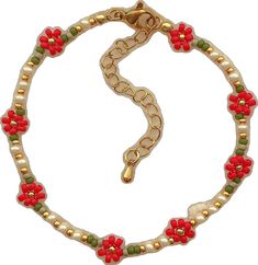 a red and green beaded bracelet with flowers on it's end, sitting in front of a white background