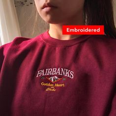 "*SIZES ARE UNISEX* -I'd suggest your usual size for a regular fit, or sizing up for a more relaxed fit. *these sweatshirts are extra comfy when oversized ⛰ \"Fairbanks Golden Heart of Alaska\" embroidered with on a comfy cute vintage-style crewneck. A sturdy and warm sweatshirt bound to keep you warm in the colder months. A pre-shrunk, classic fit sweater that's made with air-jet spun yarn for a soft feel and reduced pilling. Your new favorite sweatshirt! * 50% cotton, 50% polyester * Pre-shrun Fall Streetwear Sweater With Letter Embroidery, Oversized Winter Sweater With Embroidered Logo, Fall Letter Embroidery Sweatshirt For Streetwear, Fall Streetwear Sweatshirt With Letter Embroidery, Oversized Fall Sweater With Embroidered Logo, Trendy Winter Sweater With Embroidered Logo, Oversized Sweater With Embroidered Logo, Oversized Sweater With Embroidered Logo For Fall, Oversized Letter Embroidery Sweater For Fall