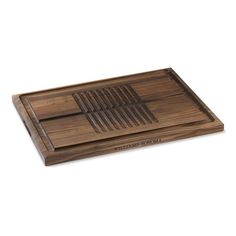 a wooden serving tray with an intricate design