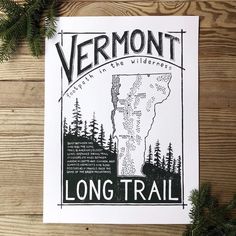 the vermont long trail map is shown on a piece of paper next to pine branches