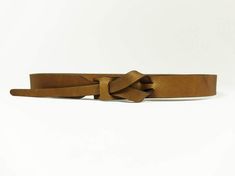 A versatile buckle-less belt, good for looping through your favorite pair of jeans or accessorizing your favorite dress. Handmade with vegetable tanned leather in Peru. ﻿Please note: Belt color may vary slightly due to hide tanning. 1" wide belt. To find your size: Measure your body at the spot you would like to wear the belt (this could be at your natural waist, low on the hips, towards the top of your ribcage, or anywhere in between!); your usual waist measurement may not work if you are plann Everyday Brown Belt Buckles With Belt Included, Adjustable Brown Belt, Adjustable Brown Belt With Self Belt Detail, Casual Brown Adjustable Belt, Casual Adjustable Brown Belts And Suspenders, Hide Tanning, Dress Handmade, Waist Measurement, Wide Belt