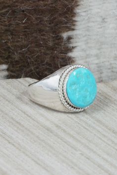 This turquoise and sterling silver ring was made by Zuni silversmith Arlen Quetawki Jr. The inside is signed AQJSize: 10Length: 3/4"Width: 3/4"Free shipping on all orders! We ship with USPS and always include tracking. All orders ship within a day of payment.Returns are accepted up to 30 days after you receive your order. Just send us a message. Our shop offers cash back or store credit. The item must be returned in new condition. Southwestern Sterling Silver Turquoise Ring For Anniversary, Classic Handmade Turquoise Ring For Anniversary, Untreated Turquoise Sterling Silver Ring, Classic Adjustable Turquoise Ring In Sterling Silver, Southwestern Sterling Silver Turquoise Ring, Handmade Classic Sterling Silver Turquoise Ring, Handmade Classic Turquoise Sterling Silver Ring, Untreated Turquoise Sterling Silver Ring For Anniversary, Untreated Turquoise Ring In Sterling Silver For Anniversary