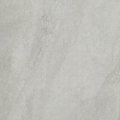 a white marble textured surface with no visible lines or markings on it, as well as the top part of the floor