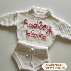 Additional colors can be found in the "INFANT" section. MARSHMALLOW- Custom Name Hand Embroidered Sweater Sets for Newborns- Includes a 0-3 months knit sweater and bloomer shorts. These knits are made of 100% cotton and are the perfect way to introduce your precious baby to the world! We also have the plain option, which is perfect to throw on for any occasion.  Shop the booties and toboggan for the full set.  MATERIALS: Our hand embroidered sweater sets are one-of-a-kind.  These sweater sets ar Fitted White Cotton Diaper Cover, White Fitted Diaper Cover For Playtime, Fitted White Diaper Cover For First Birthday, Birth Announcement Outfit, Announcement Outfit, Sweater Shorts, Sweater Sets, Bloomer Shorts, Personalized Sweater