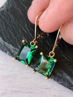 Emerald Earrings, May Birthstone, Dark Green Rectangle Earrings in Gold or Silver, Emerald Quartz Baguette Drops, Jewelry Gift for Mom These elegant baguette earrings feature dark green emerald quartz rectangle gemstones prong set in your choice of gold filled or sterling silver. The emerald color drops are suspended from lever back ear wires in the finish of your choice. These are great choice for simple yet elegant earrings to wear virtually anywhere. Ideal gift for a woman born in May, as thi Formal Rectangular Earrings With May Birthstone, Emerald Rectangular Earrings For May Birthstone, Elegant Rectangular Emerald Earrings For May Birthstone, Elegant Rectangular May Birthstone Earrings, Rectangular Gemstone Earrings For May Birthstone, Elegant Green Rectangular Earrings, Elegant Oblong Jewelry With Ear Wire, Green Rectangular Earrings For Formal Occasions, Gold Emerald Rectangular Earrings