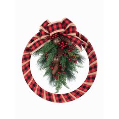 a red and black wreath with pine cones, berries and evergreens on it hanging from the front of a white wall