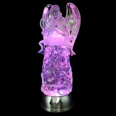 a glass figurine that has been made to look like an angel