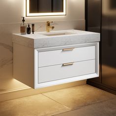 a bathroom vanity with two drawers and a lighted mirror above it, in front of a wall mounted cabinet