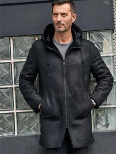 Men's B7 Bomber Shearling Leather Coat In Black This Men's B7 Bomber Shearling Leather Coat In Black by Arcane Fox is the perfect addition to your winter wardrobe! It features a bomber-style shearling outer shell, as well as faux shearling lining that keeps you warm and comfortable throughout the season. The peaked hood with zipper closure adds a little extra style versatility, while pockets provide convenient storage for your phone and wallet. Outer Shell: Real Leather Leather Type: Sheepskin L Classic Sheepskin Fur Coat For Winter, Black Sheepskin Fur Coat With Faux Fur Lining, Black Leather Fur Coat With Faux Fur Trim, Classic Black Fur Coat With Faux Fur Trim, Black Shearling Fur Coat For Fall, Classic Black Fur Coat With Faux Fur Lining, Classic Black Sheepskin Outerwear, Black Sheepskin Fur Coat For Cold Weather, Black Leather Jacket With Fleece Lining