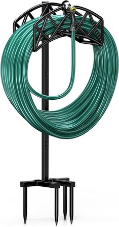 a green hose is attached to a black stand