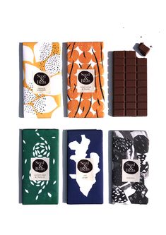 four different types of chocolate bars on a white background