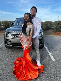 Orange Prom Outfits For Couples, Orange Prom Dress Black Couple, Prom Cars Ideas, Orange Prom Couple, Prom Ideas Black Couples, Black Couple Prom, Prom Black Couples, Couples Prom Outfits