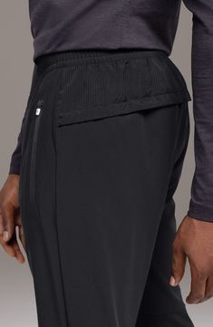 Lightweight, moisture-wicking fabric with plenty of stretch keeps you comfortable for miles in track pants fitted with targeted mesh paneling for ventilation. A quartet of secure pockets offers room to stow keys, currency, tech and energy gels where they're easy to get to when you need them. 31" inseam; 16" leg opening; 13" front rise; 16" back rise (size Medium) Back elastic waist Front zip pockets; back snap pockets Drawcord-toggle hem with zips Breathable mesh allows ventilation of excess hea Track Pant, Mesh Panel, Moisture Wicking Fabric, Workout Pants, Track Pants, Moisture Wicking, Zip Pockets, Elastic Waist, Nordstrom