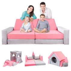 a family sitting on a pink couch with their dog house and cat houses in the background