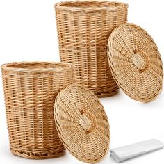 three wicker baskets with lids on each side and a white object in the middle