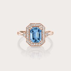 The Katerina ring is our show-stopping piece and has a large 1.8CT Blue Topaz London stone in the center. Adorning the stone are 28 sparkling diamonds creating a halo effect around the stone. It’s a ring inspired by royalty and it's absolutely glamorous. **Due to the nature of the stone the color of the center stone may vary** All features can be customized! please contact us if you wish to make changes, we love making custom designs. All of our jewelry is carefully handmade in our atelier *HC diamond are all conflict free diamonds To order by phone click here>> +972(0)722991000 Baguette Cut Topaz Ring With Diamond Halo Setting, Baguette Cut Topaz Ring With Diamond Halo, Sapphire Topaz Ring With Diamond Center Stone, Wedding Topaz Ring With Brilliant Cut In Octagon Shape, Octagon Brilliant Cut Topaz Wedding Ring, Blue Octagon Ring With Halo Setting, Blue Octagon Halo Setting Rings, Blue Topaz Halo Ring For Wedding, Octagon Blue Rings With Halo Setting