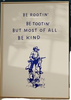 a sign on the side of a building that says be rootin'bettotin but most of all be kind