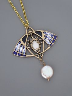 "Art Deco Inspired Necklace - Cicada Necklace - Butterfly Necklace - Gold Enamel Necklace - Bug Jewelry - Blue Necklace - Chloes Vintage This is such a stunning Art Deco inspired necklace! This gorgeous blue and white enamel cicada/butterfly is embellished with a white stone and fresh water pearl. The pendant hangs from a gold plated chain. Chloe says, Wear it and feel fabulous!\" The pendant is 1 3/4\" wide and 2 1/16\" tall Thanks for visiting Chloe's" Art Nouveau Pendant Necklaces For Jewelry Making, Art Nouveau Jewelry With Artistic Design For Gift, Handmade Art Nouveau Pendant Necklace, Handmade Art Nouveau Necklace For Gift, Handmade Art Nouveau Necklace Gift, Art Nouveau Adjustable Jewelry For Gifts, Art Nouveau Adjustable Jewelry As A Gift, Adjustable Art Nouveau Jewelry As Gift, White Artistic Jewelry As A Gift