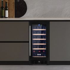 a wine cooler sitting in the middle of a kitchen