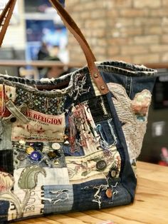 a handbag is sitting on a wooden table