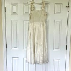 Perfect For Wedding Shower Or Rehearsal Dinner, Especially For Summer Brides! Never Worn. Straps Are Adjustable As They Tie In Bows. Stretchy Top. Mid Length Off White Sleeveless Maxi Dress For Daywear, Off White Sleeveless Cotton Midi Dress, Sleeveless Summer Maxi Dress For Wedding, Sleeveless Cotton Midi Dress For Wedding, Sleeveless Cream Maxi Dress For Casual Wear, Cream Sleeveless Maxi Dress For Casual Occasions, Off White Sleeveless Sundress Midi Dress, Off White Sleeveless Midi Dress For Vacation, Off-white Sleeveless Midi Dress For Vacation