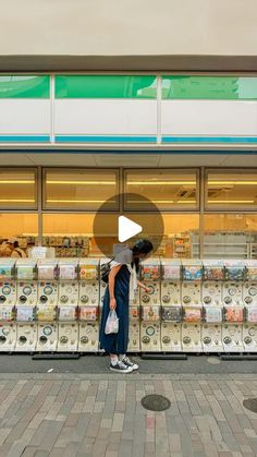 a person standing in front of a store