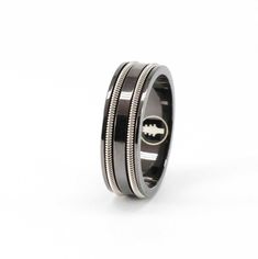 Designed to transform through everyday wear, Heartstrings' Black Guitar String Ring features a black rhodium plating over a sterling silver ring wound with your choice of one or two strands of electric nickel guitar strings. The black plating gradually thins over time, presenting as a patina that allows the silver undertones to shine through. Heartstrings' eco-friendly promise delivers jewelry and packaging that transform end-of-life materials into beauty for even the most discerning. Guitar String Ring, Guitar Ring, String Ring, Guitar String Jewelry, Black Guitar, Electric Guitar Strings, Heart Strings, Gold Jewelry Necklace, Guitar Strings