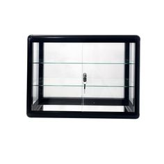 a black and glass display case on a white background with the door open to reveal a keyhole