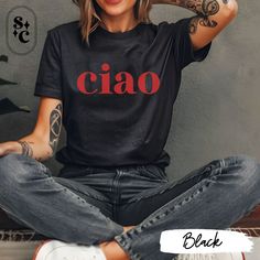 Elevate your style with our trendy "Ciao" shirt, featuring the word "Ciao" in bold red font. Perfect for the downtown girl, this cool minimalist tee exudes effortless chic and Italian flair. This cute preppy t-shirt is ideal for anyone embracing a relaxed yet fashionable look. Whether you're strolling through the city or enjoying a coffee date, this trendy shirt is versatile and stylish. Looking for an Italia-themed gift? This "Ciao" shirt captures the essence of Italian vibes, making it a thoughtful and fashionable present. Add a touch of European elegance to your wardrobe with this must-have Ciao shirt and make every outfit a statement! 💕Proudly printed on Bella Canvas Unisex T-shirt 3001 - 100% Airlume combed and ringspun cotton - Light fabric - Super soft - Runs true to size 💕Size Th Chic Summer T-shirt With Letter Print, Casual Summer Tops With Name Print, Trendy Crew Neck T-shirt With Name Print, Chic Cotton Crew Neck Shirt, Casual Tops With Name Print, Trendy Summer T-shirt With Name Print, Casual Summer T-shirt With Name Print, Trendy Name Print T-shirt For Summer, Casual Name Print T-shirt For Summer