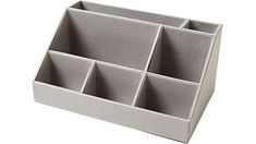 a gray organizer with six compartments on the bottom and one section open to show it's contents