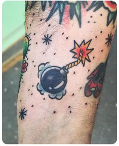 a man's foot with tattoos on it and an image of a rocket ship