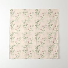 a pink and green floral pattern on a white wall hanging from the side of a wooden frame