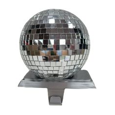 a disco ball is sitting on a metal stand