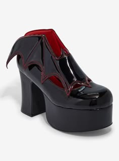 Sink your fangs into these black Vampira heels! Featuring bat wing appliqué detailing and red contrast stitching. Listed in women's sizes.Platform: 2''Heel: 4''Polyurethane upper; rubber soleImported Edgy Black Heels For Halloween, Black Platform Heels For Halloween, Halloween Platform Heels With Pointed Toe, Black Heels For Halloween Party, Black Punk Heels For Halloween, Gothic Black Heels For Halloween, Gothic Black Heels For Night Out, Black Round Toe Heels For Cosplay, Black Platform Heels For Cosplay