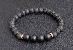 Black lava bead stretch bracelet with Onyx and copper accents. Bracelet is for men and unisex. Casual Black Lava Stone Bracelet, Elegant Black Lava Stone Beaded Bracelets, Black Lava Stone Stretch Bracelet As Gift, Bracelet For Boyfriend, Bracelets Style, Bracelets For Boyfriend, Copper Accents, Lava Bead, Beaded Stretch Bracelet